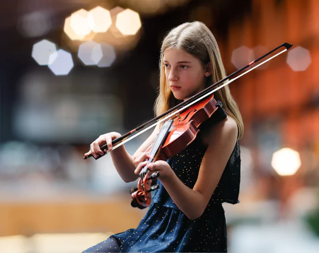 Young Girl Student at Texas School of Music playing violin